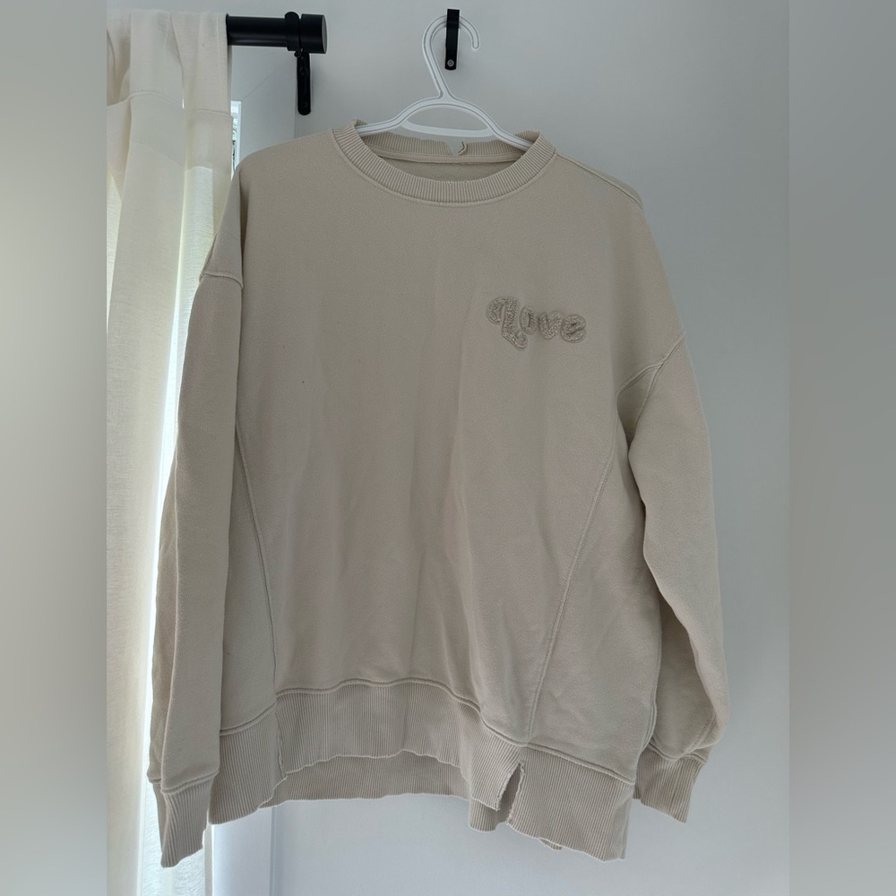 Oversized distressed hem sweatshirt